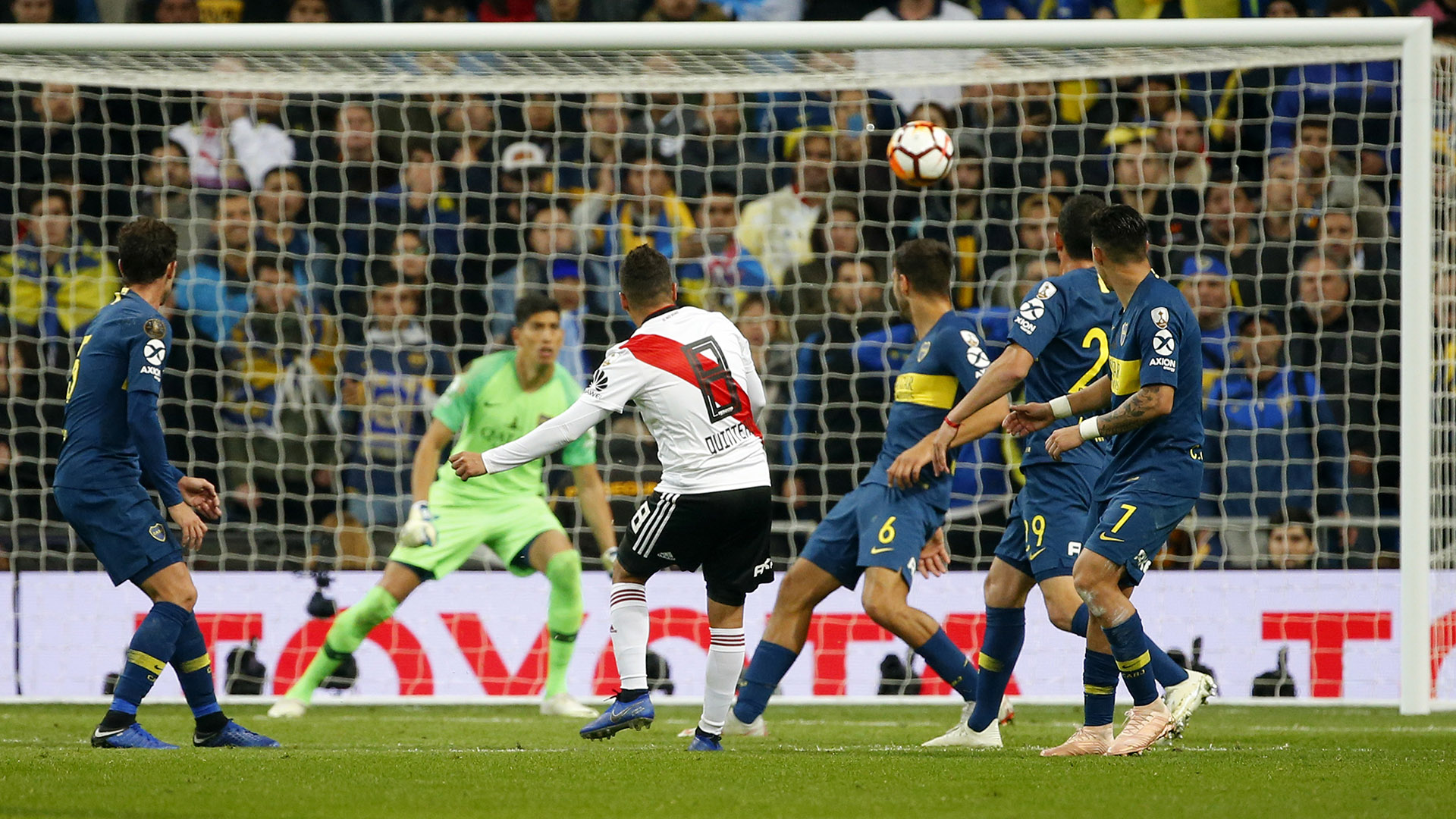 Juan Quintero of Argentina's River Plate, 8, scores his side's second goal against Argentina's Boca Juniors during extra time of the Copa Libertadores final soccer match at the Santiago Bernabeu stadium in Madrid, Spain, Sunday, Dec. 9, 2018. (AP Photo/Andrea Comas).