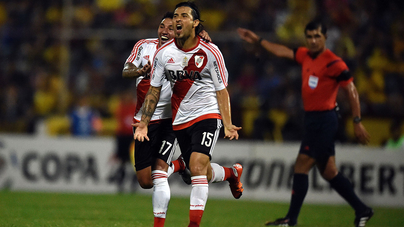Argentinian River Plate Leonardo Pisculichi (R) and Claudio Salto celebrates after scoring against with Venezuelan Trujillanos during their Copa Libertadores 2016 tournament football match against Stadium Jose Alberto Perez in Valera, Venezuela on February 25, 2016. AFP PHOTO/JUAN BARRETO / AFP / JUAN BARRETO (Photo credit should read JUAN BARRETO/AFP/Getty Images)