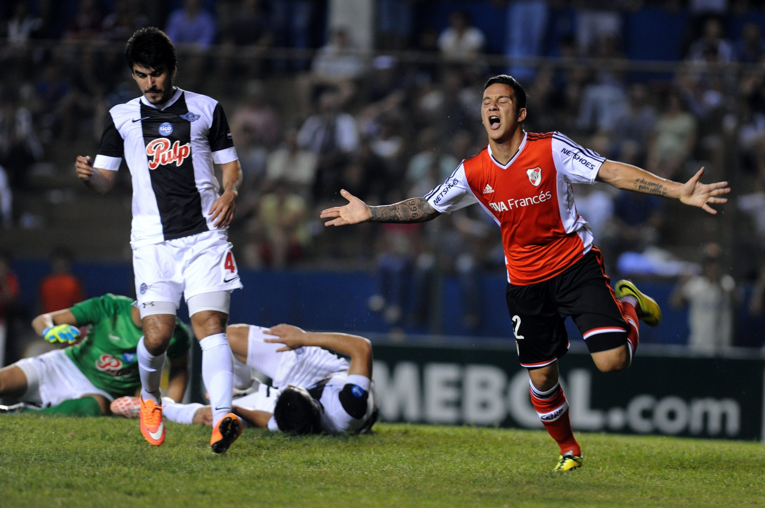 Sebastian Driussi of Argentina's River Plate celebrates after scoring against Paraguay's Libertad during the 2014 Copa Sudamericana held at Nicolas Leoz stadium in Asuncion, Paraguay on October 16, 2014 AFP PHOTO/NORBERTO DUARTE (Photo credit should read NORBERTO DUARTE/AFP via Getty Images)