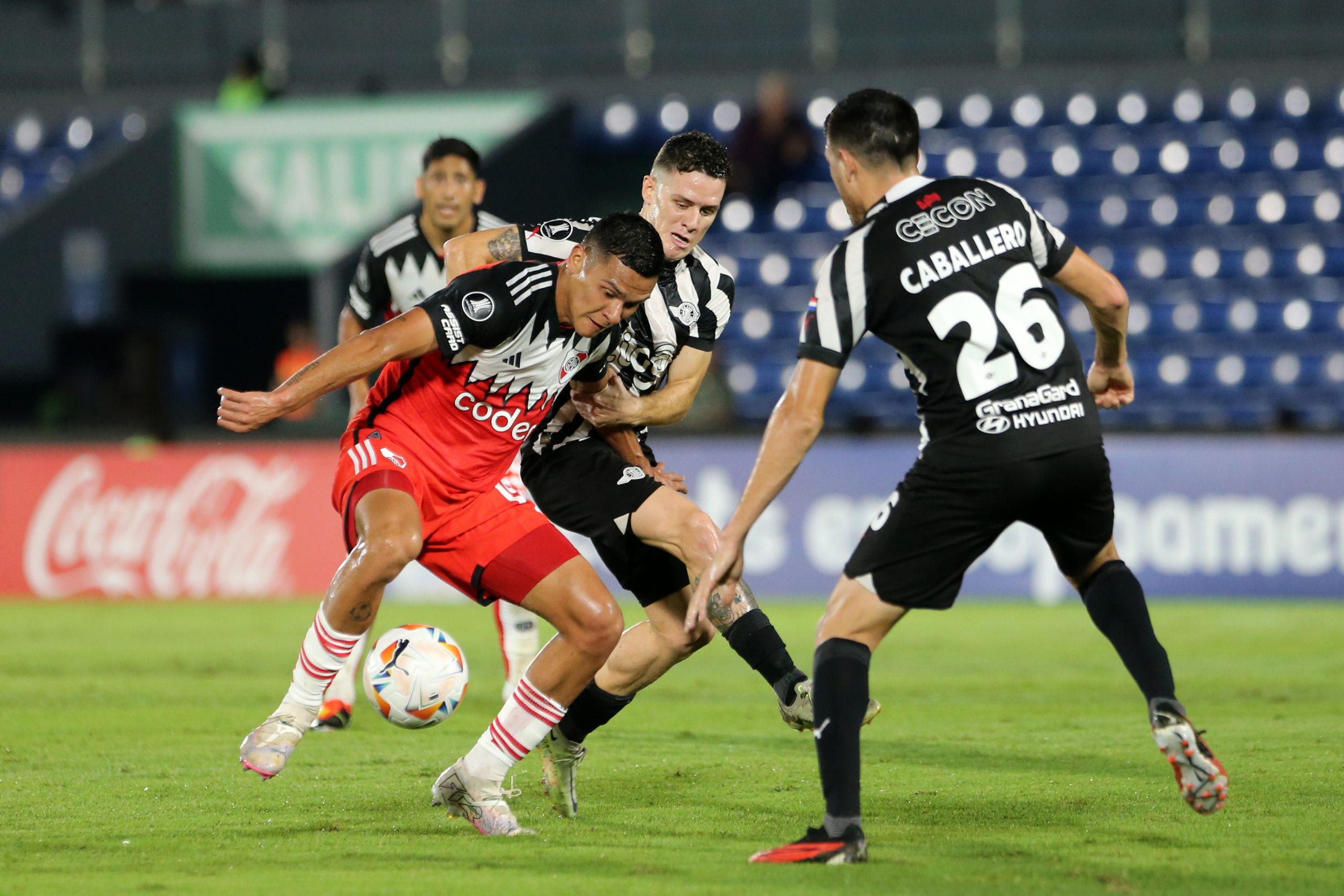 ASUNCION, PARAGUAY - APRIL 24: Marcelo Herrera of River Plate and Bautista Merlini of Libertad battle for the ball during a Copa CONMEBOL Libertadores 2024 Group H match between Libertad and River Plate at Estadio Defensores del Chaco on April 24, 2024 in Asuncion, Paraguay. (Photo by Christian Alvarenga/Getty Images)
